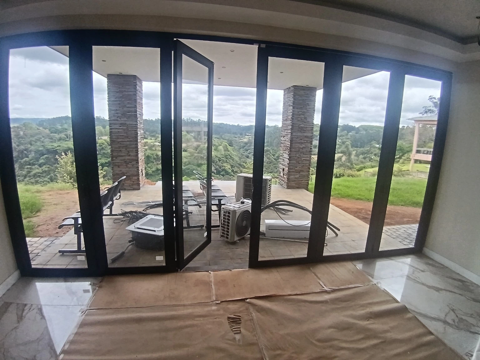 Black aluminium folding doors installation